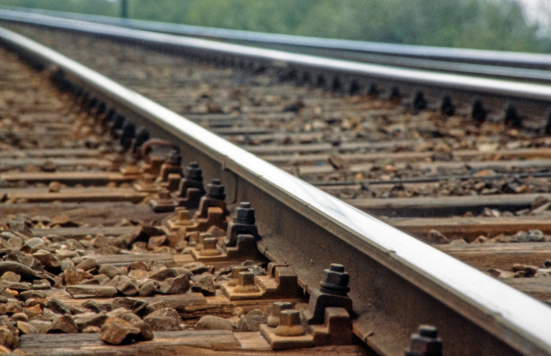 Close-up of railway track showing rail, fastenings and sleepers