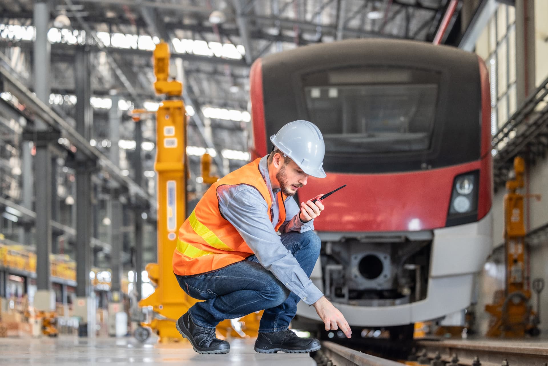 Rail engineer working in a train depot