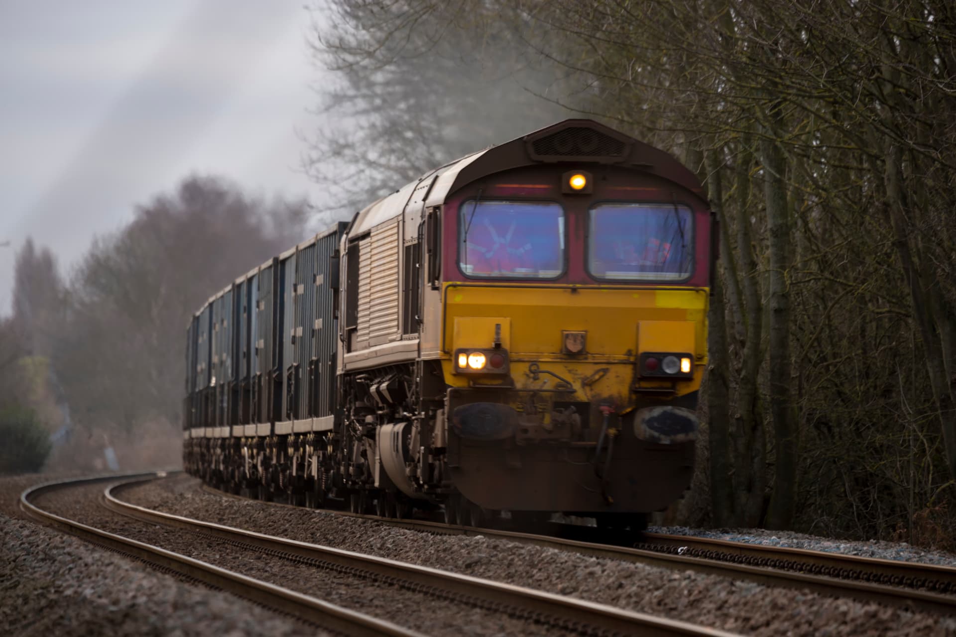 Train arriving at a UK railway station platform